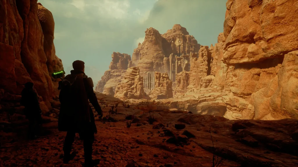 Screenshot aus Star Wars Jedi: Survivor auf dem ein männlicher Charakter zu sehen ist, welcher sich in einer Art Schlucht befindet.