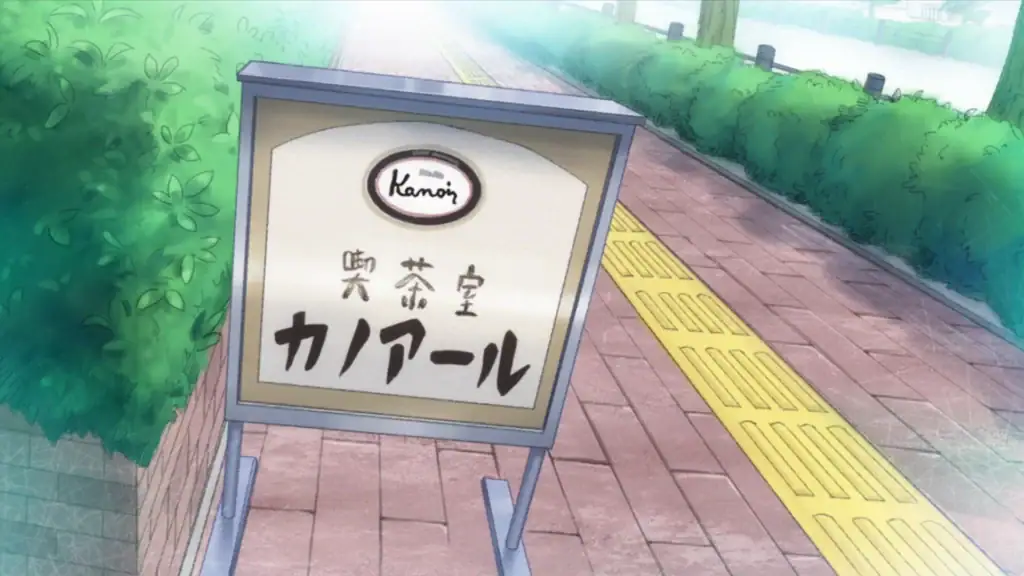 Screenshot auf Rent-a-Girlfriend: Zu sehen ist ein Schild, auf einem Gehweg. Der Screenshot zeigt deutlich den Stil des Animes, sieht aus wie gezeichnet.