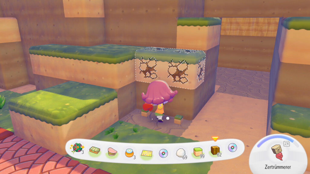 Dragon Quest Builders nur im Pokémon Universum? Meine Eindrücke zu Pokémon Pokopia! Screenshot aus Pokémon Pokopia: Eine Figur mit stylischer Frisur baut gerade Erdblöcke ab.